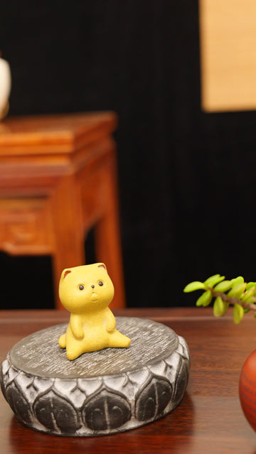 A Spaced-Out Yellow Kitten handmade pottery figurine decor (tea pet) made by yixing purple clay