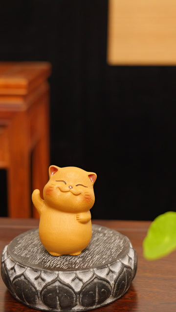 A cheerful yellow kitten handmade pottery figurine decor (tea pet) made by yixing purple clay