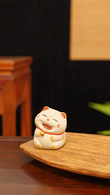 A chubby cat with a bell handmade pottery figurine decor (tea pet) made by yixing purple clay