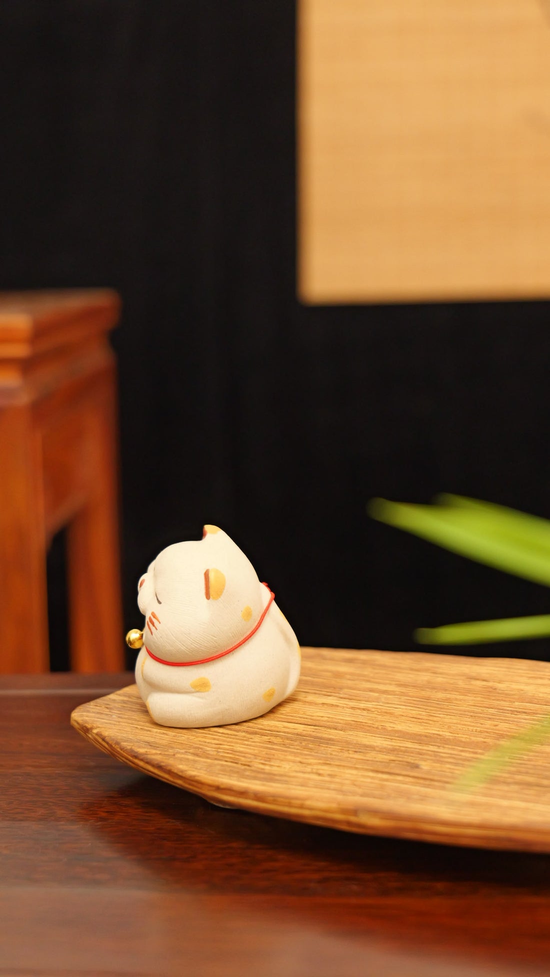 A chubby cat with a bell handmade pottery figurine decor (tea pet) made by yixing purple clay