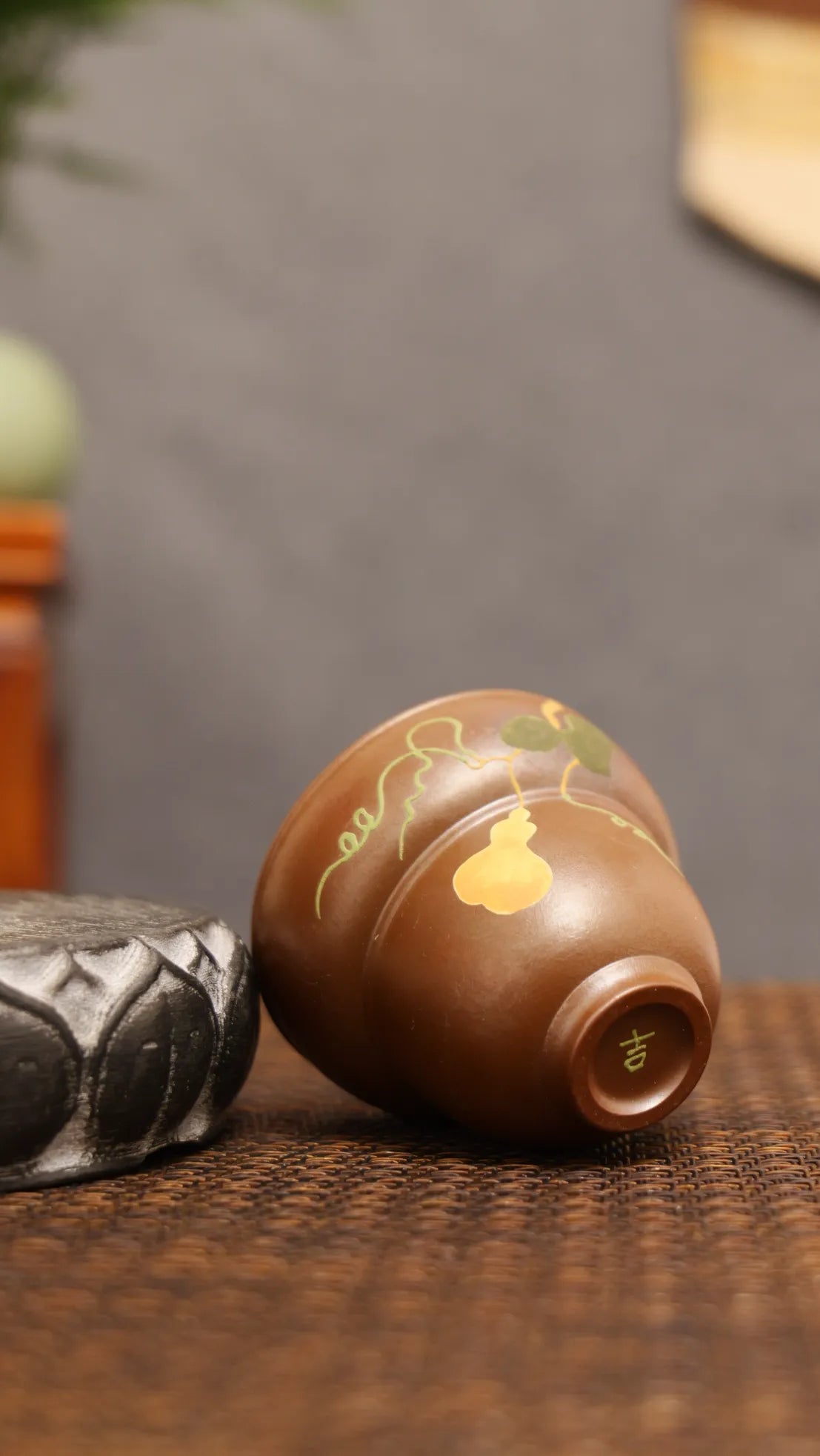 Golden Harvest: Yixing Zisha Teacup with Gourd Vine Motif