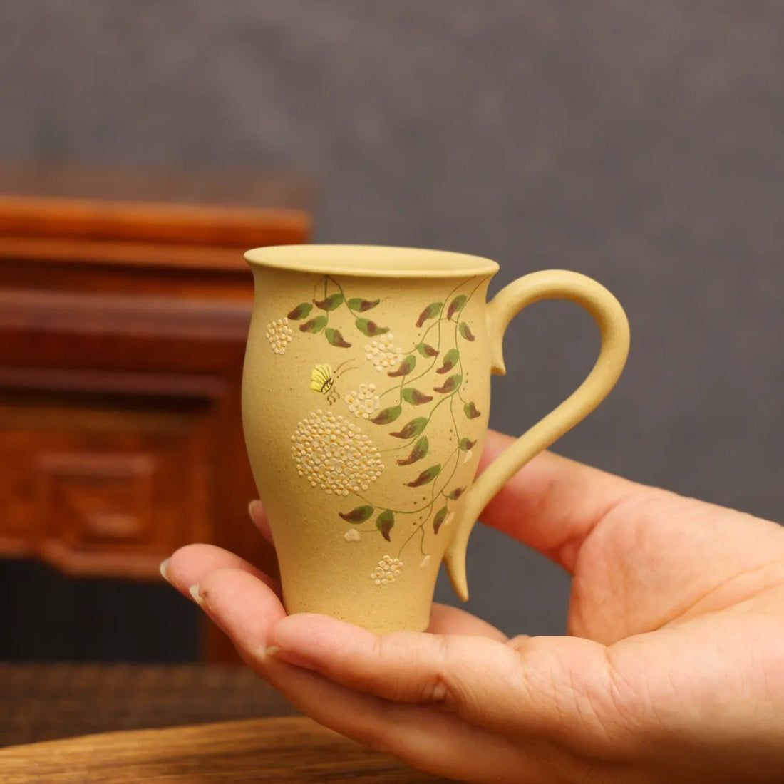 Whispering Orchid: Yixing Zisha Teacup with Butterfly Embrace