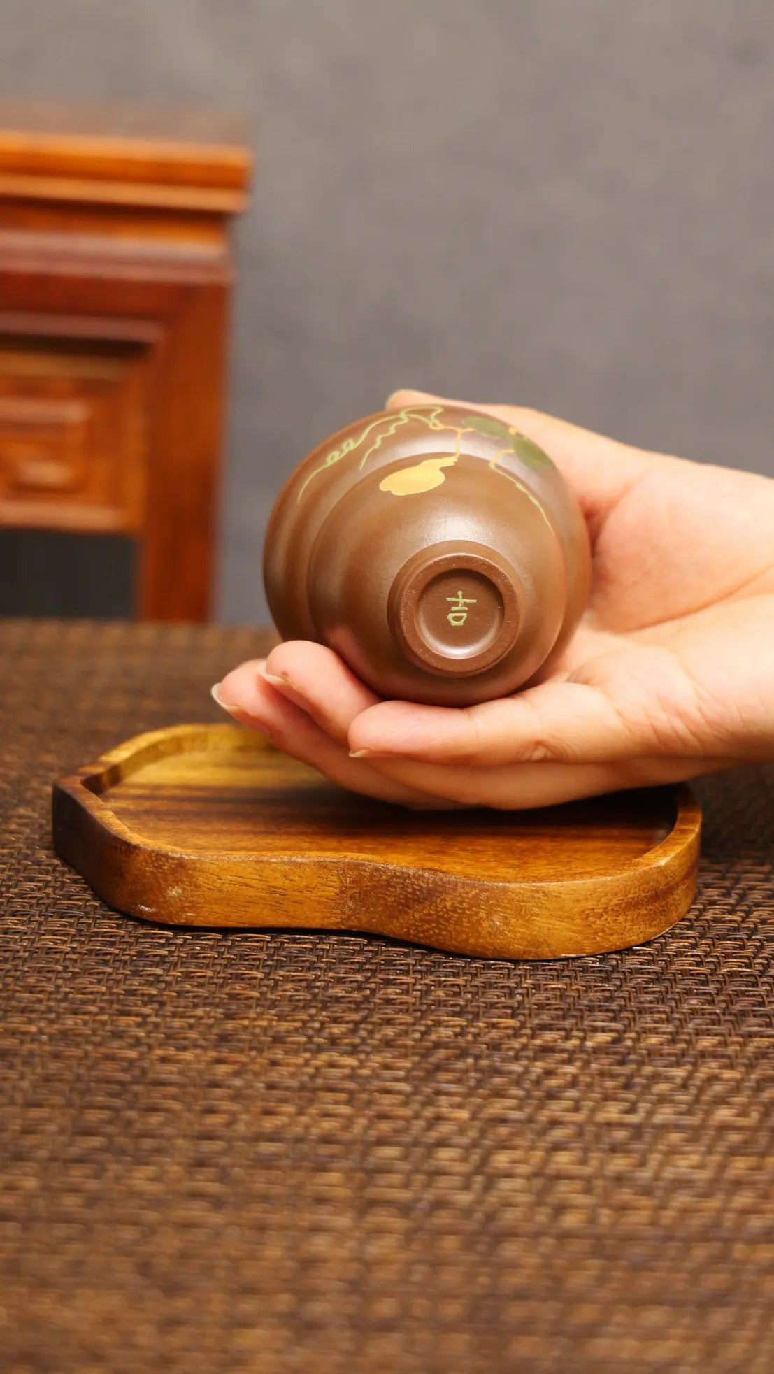 Golden Harvest: Yixing Zisha Teacup with Gourd Vine Motif