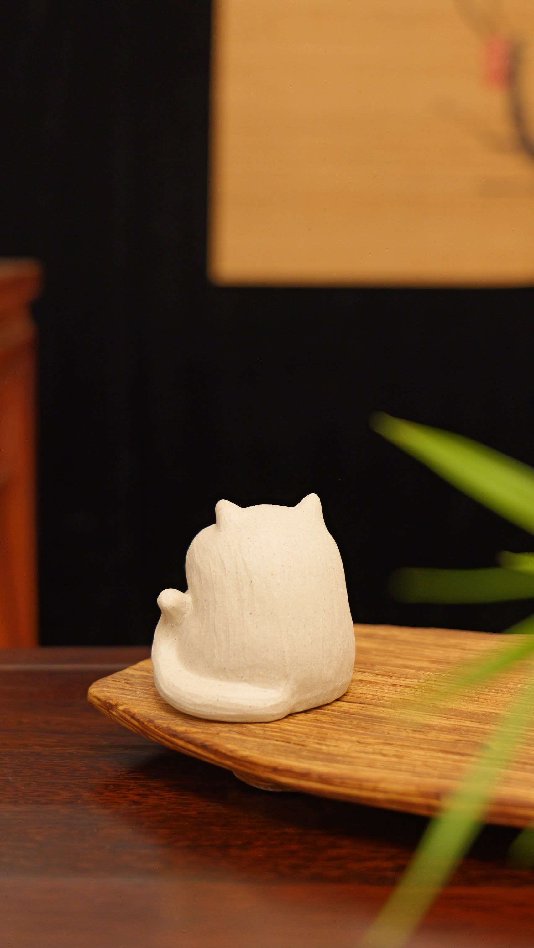 white cat holding gold handmade pottery figurine decor (tea pet) made by yixing purple clay