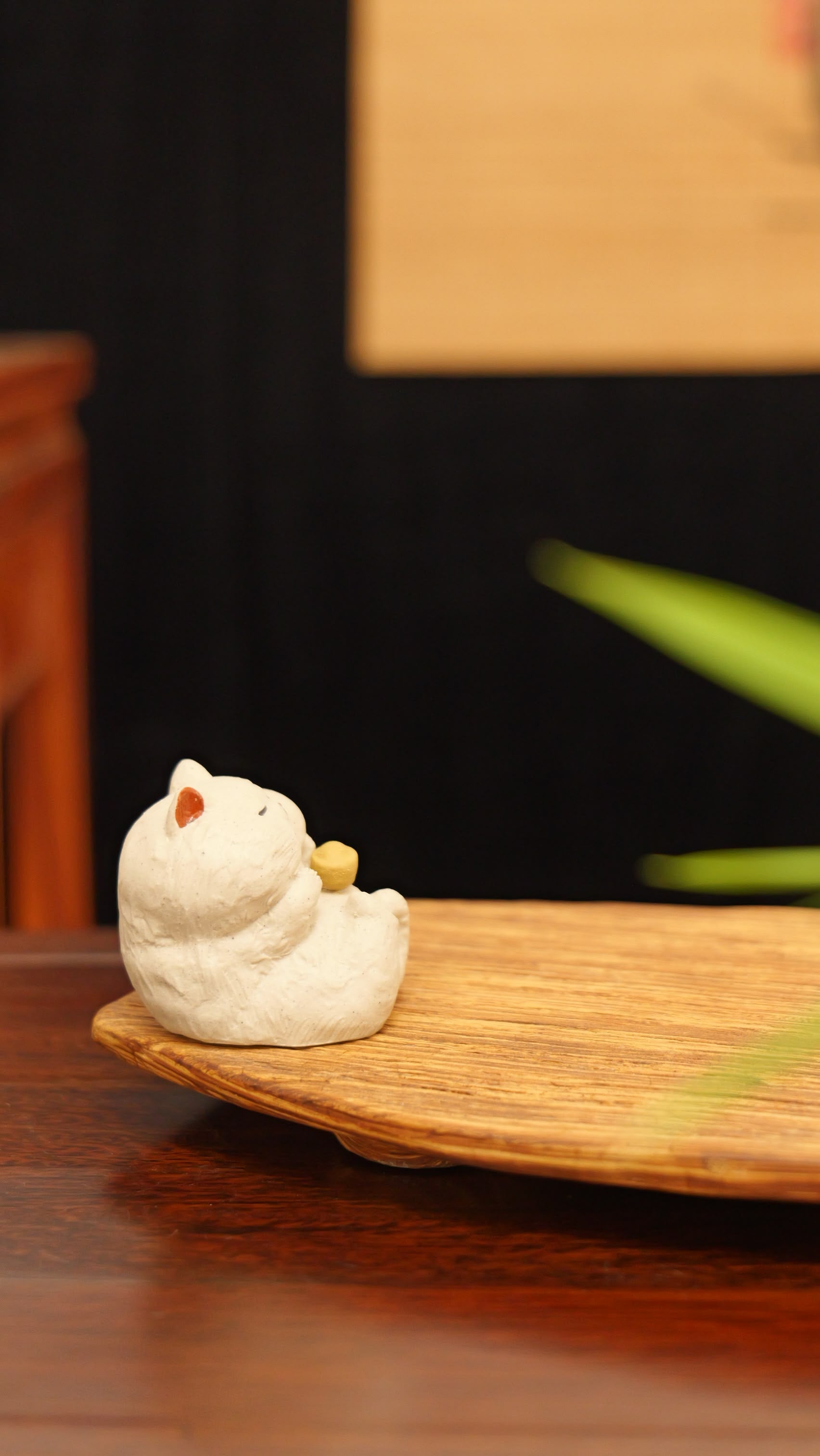 white cat holding gold handmade pottery figurine decor (tea pet) made by yixing purple clay
